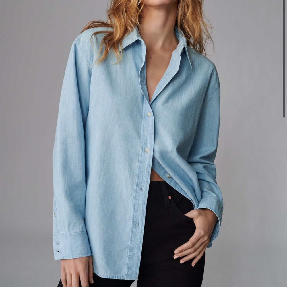 Denim shirt with pearl button details. Relaxed for. Brand new, never worn.